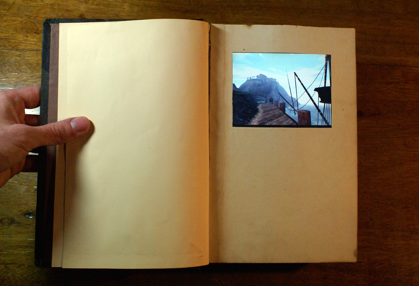 The replica real Myst book open to the front page, showing the linking panel open to Myst Island's dock